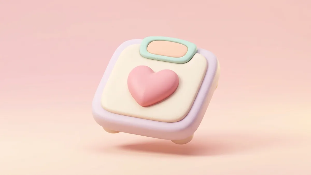 A 3D clay bathroom scale with a pink heart on a soft pink background